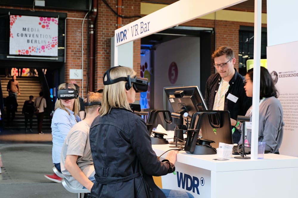 attendees wearing virtual reality headsets at event location