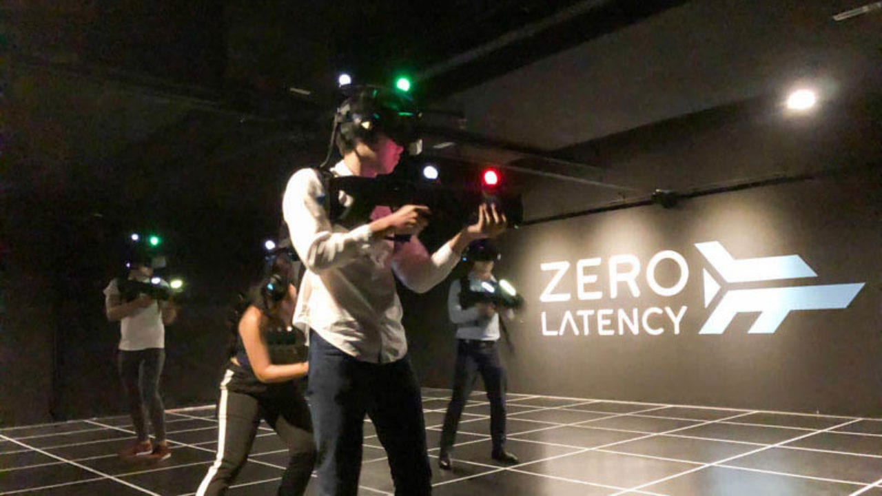 People playing VR games in a group at Zero Latency in Singapore