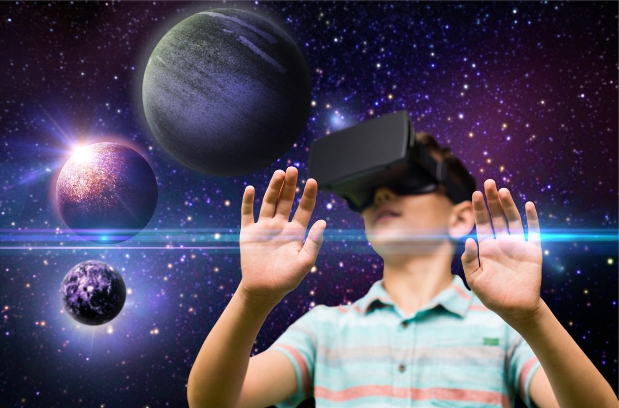 The boy excitedly viewing the solar system through VR